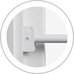 Security bar inserted into bracket on a sliding patio door