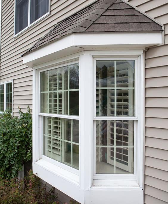 Three-panel bay window at 30°/45° with a cozy seat-board.