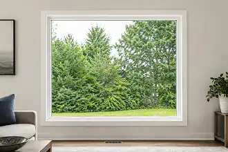 Large white uPVC fixed window bringing natural light into a modern room