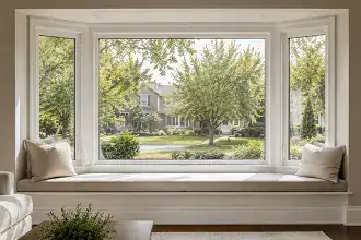 Bay window with an angled multi-window projection on a residential home exterior.